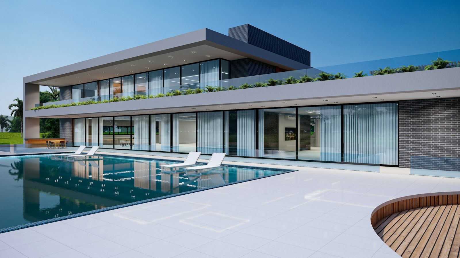 A long, low modern house with a pool in front