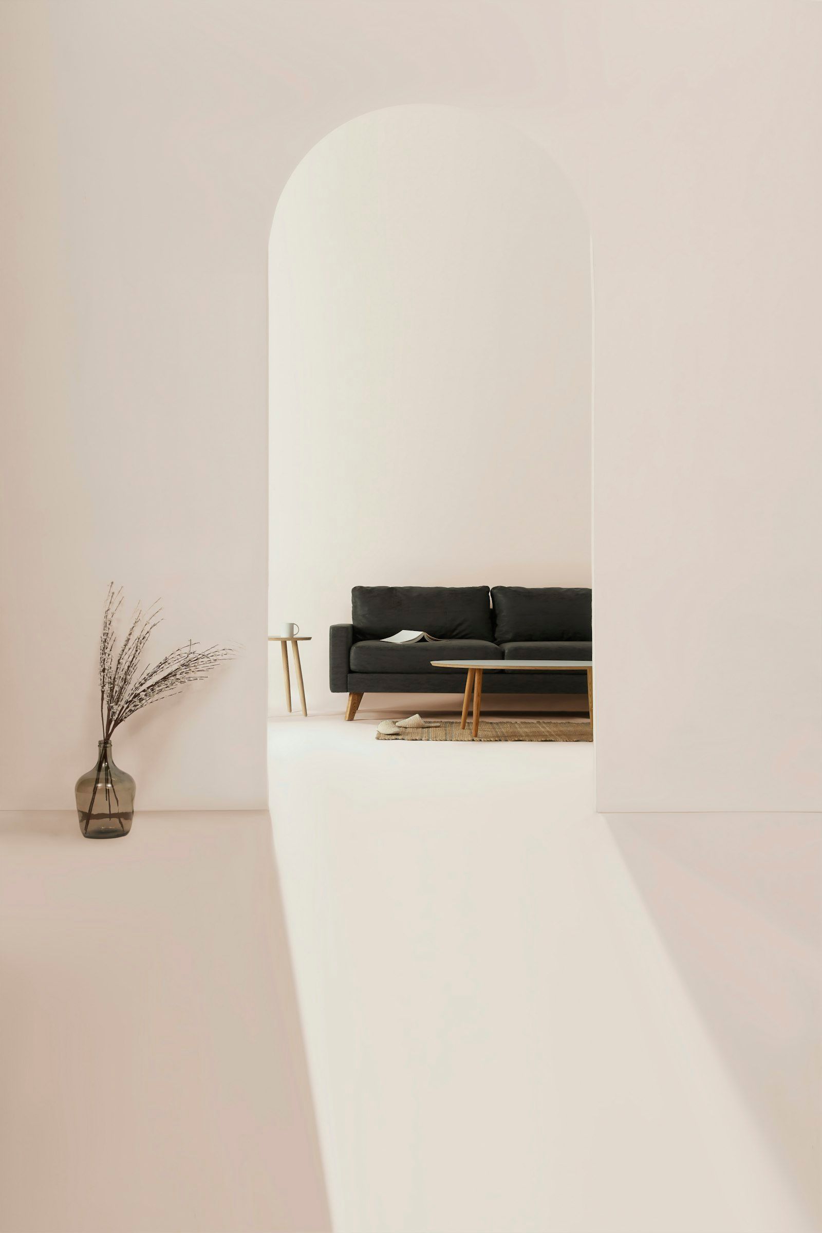 A calm, white living room with a low sofa